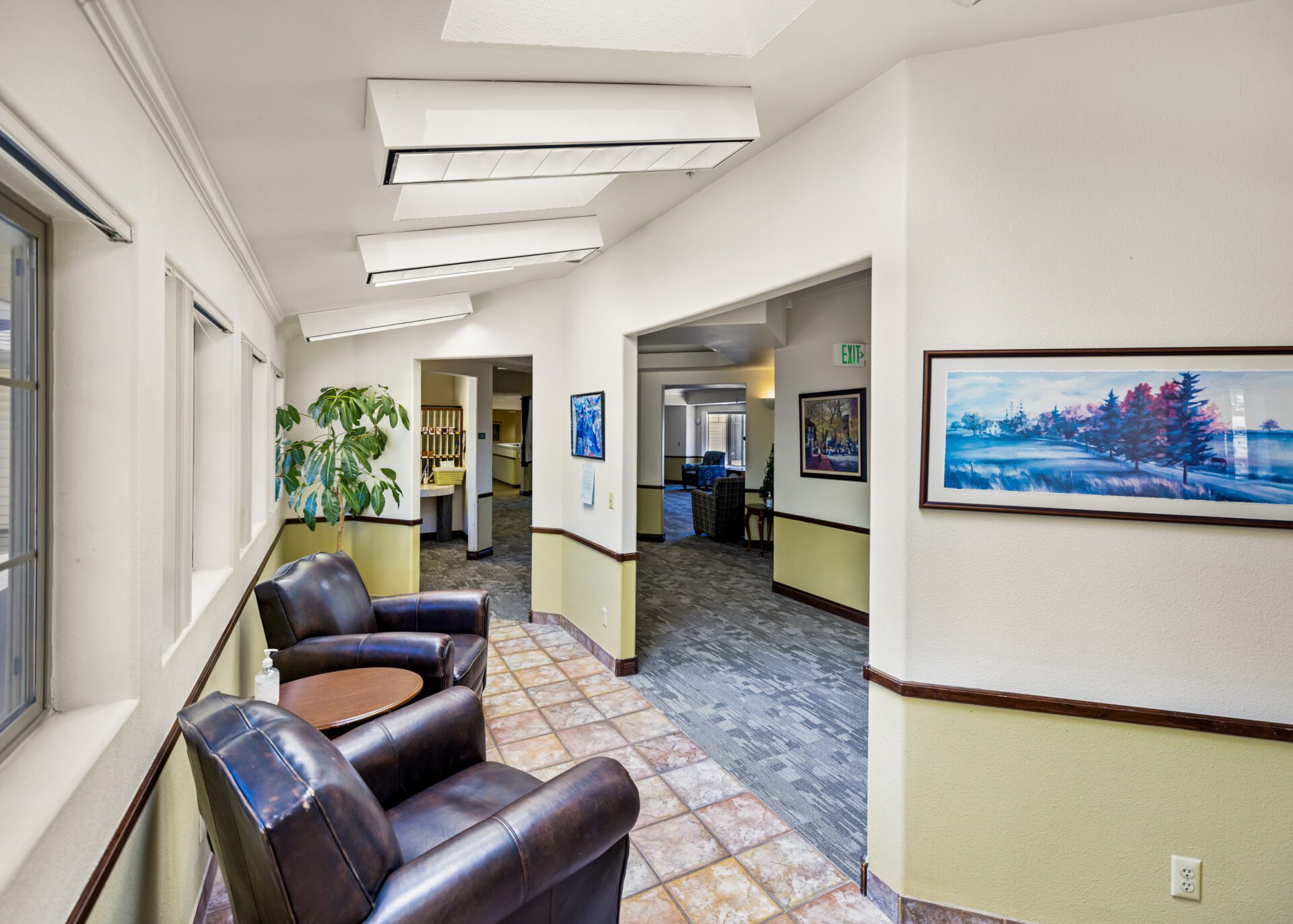 Library Room Filled With Books And Reading Chairs