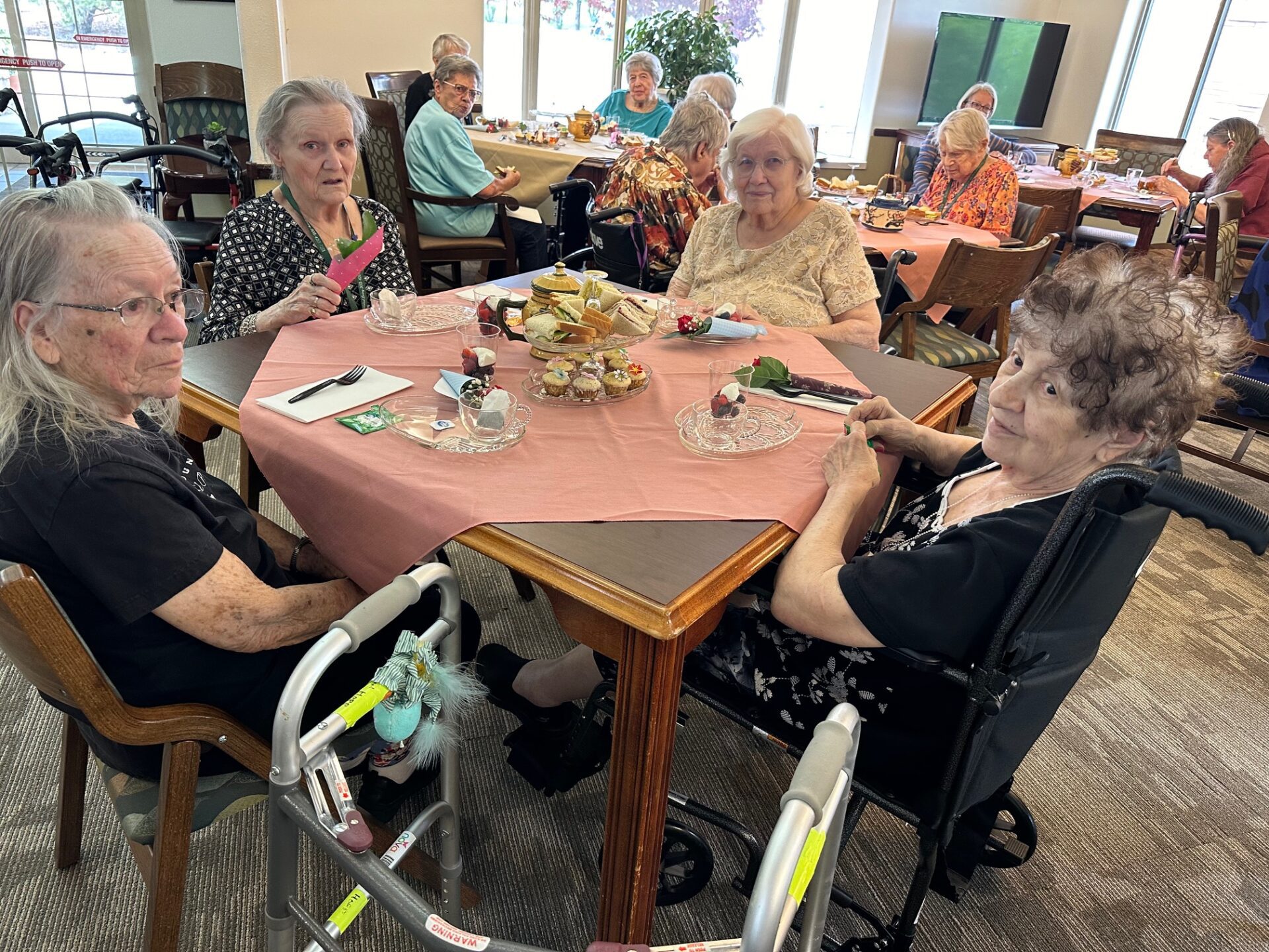 Residents Enjoying A Communal Meal Together