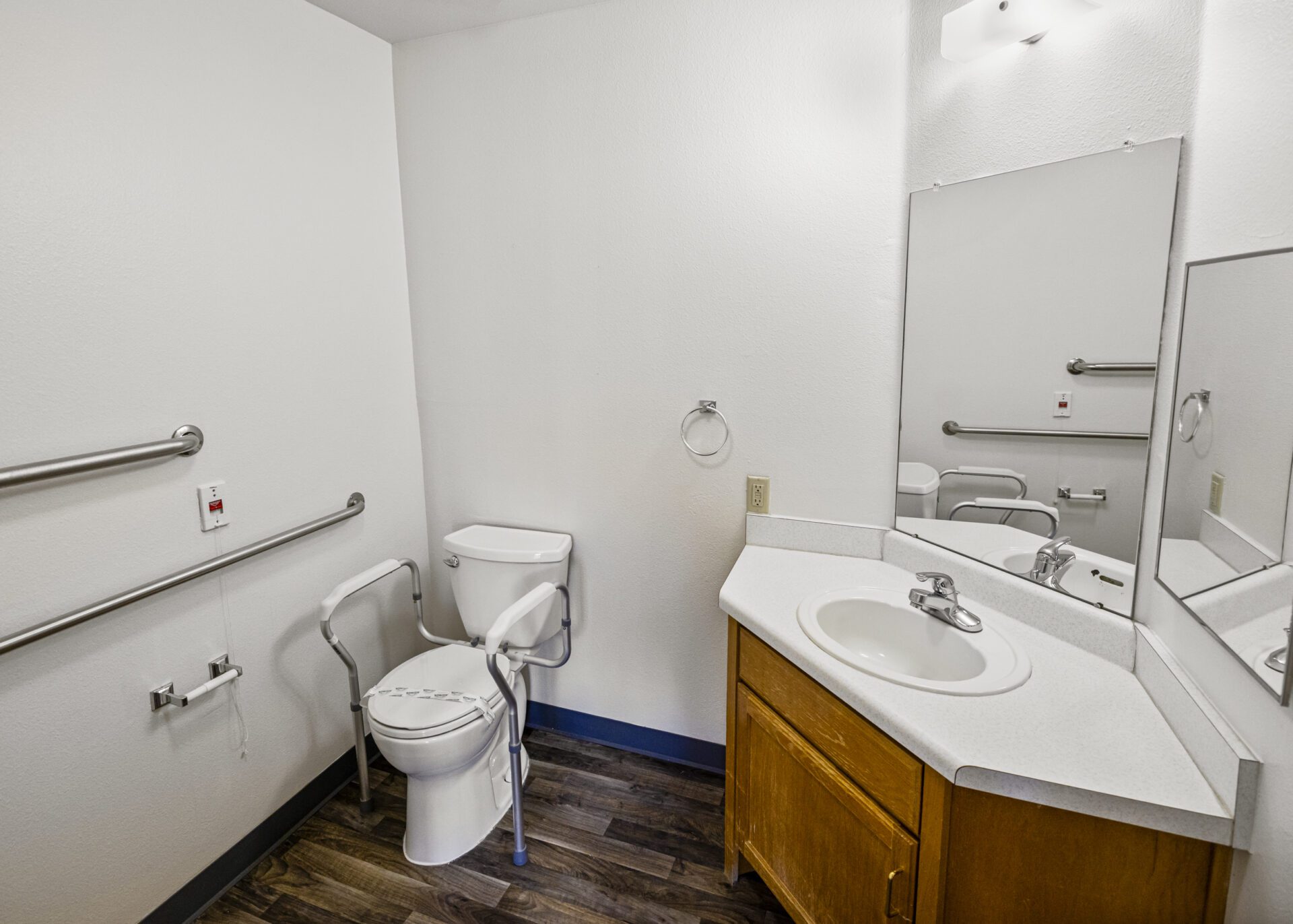 Accessible Toilet With Safety Rails